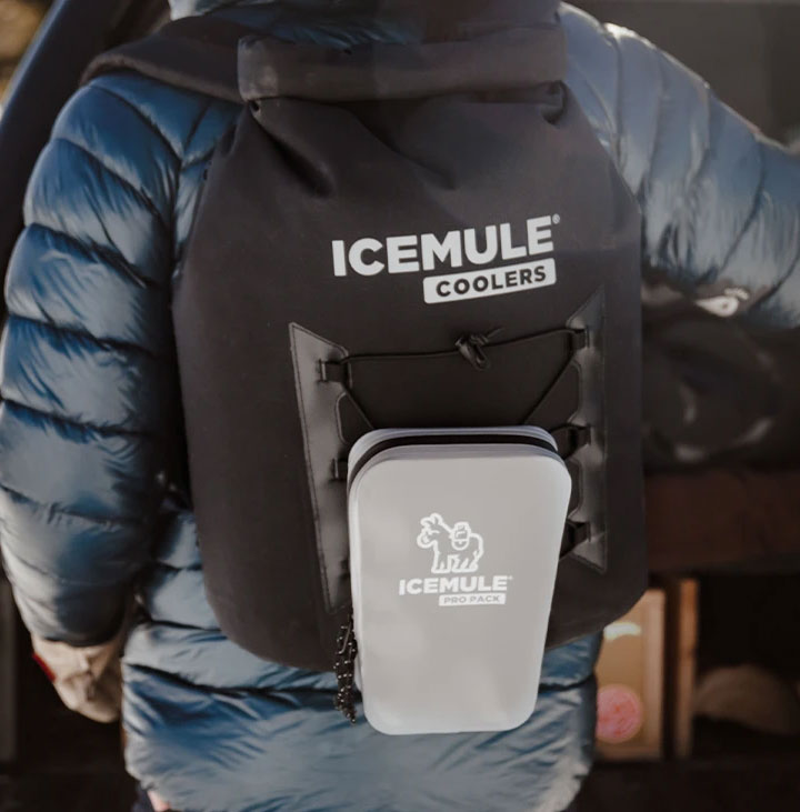 person wearing icemule cooler and pack